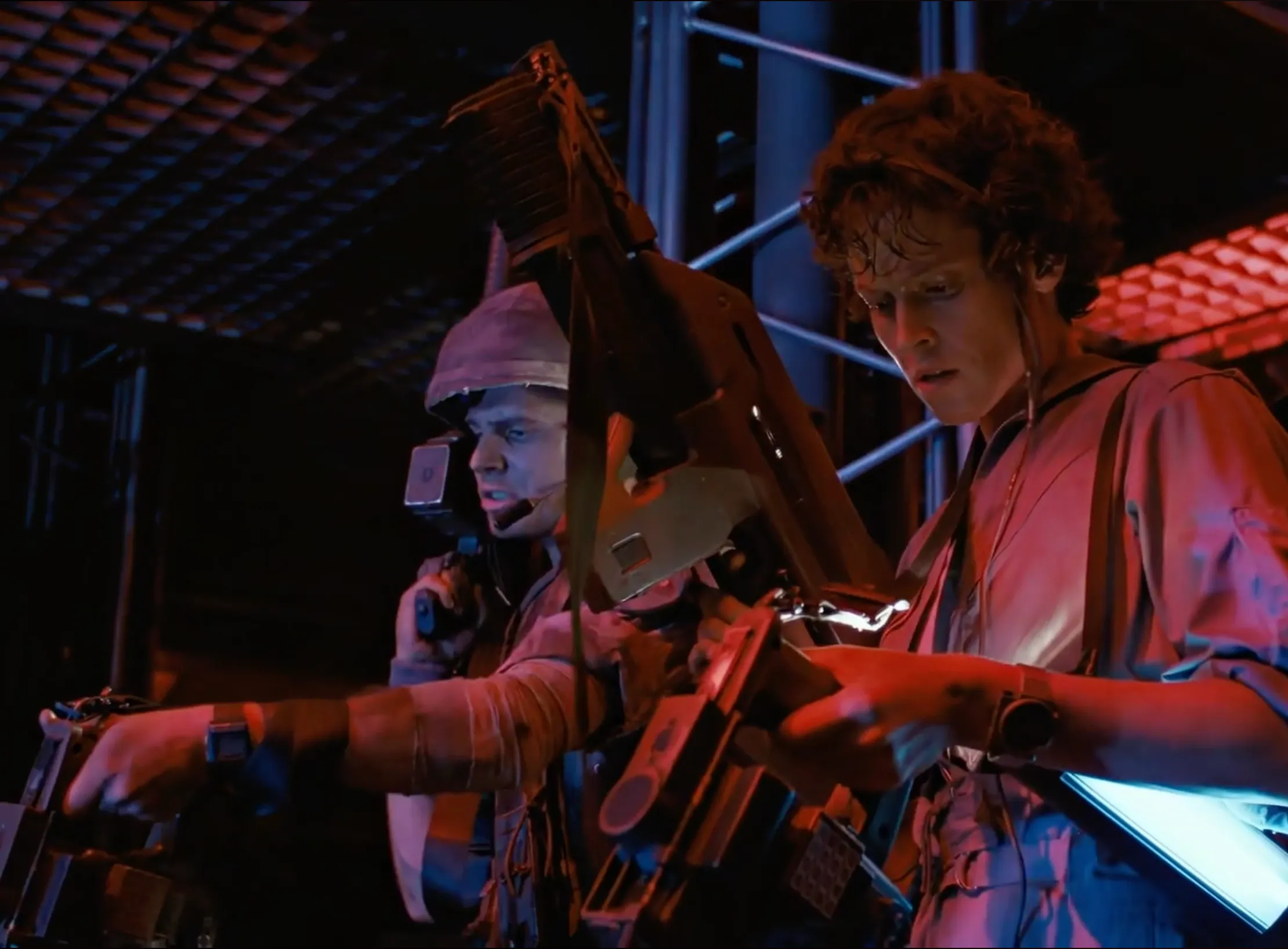 Ripley and a colonial marine holding a motion tracker device